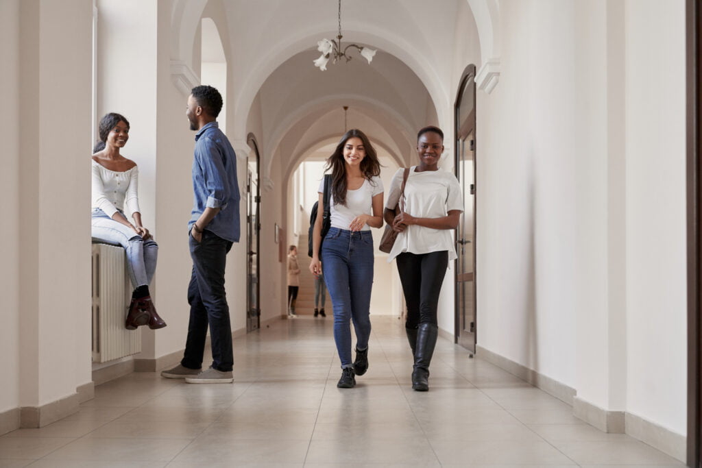 Multiracial happy group of students taking rest together